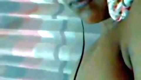 Sexy brunette girl in a white dress shows her natural boobs