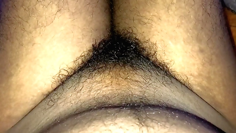 Hairy girl takes the camera and makes homemade solo video