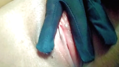 Solo female with a pink cunt takes off her clothes