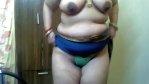 Indian brunette with big tits is having fun in a solo scene