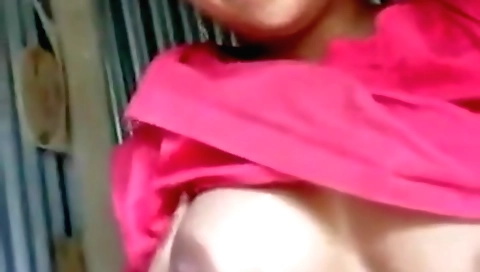 Busty brunette naked in her bed on camera in amateur video