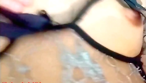 Stunning Asian woman in a sexy dress fucks on the couch