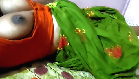 Indian girl in red dress playing with a book and getting a lot