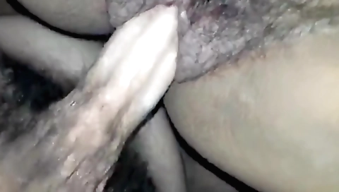 A hairy brunette gets a cum plug on her hairy pussy