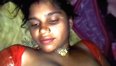 Indian woman with a shaved pussy is riding her husband's cock