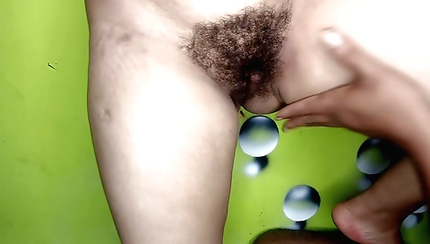 Indian girl with a hairy pussy gets fucked with a toy