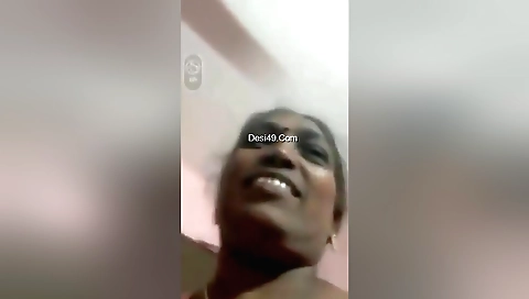 Mature brunette shows her boobs during masturbation