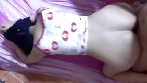 A beautiful brunette is getting her mouth full of a big cock