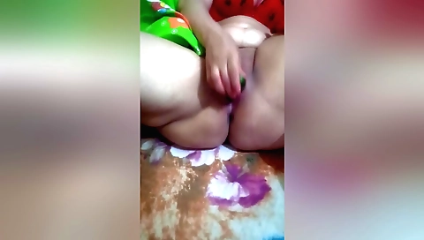 Slutty chick with a shaved body plays with her pussy